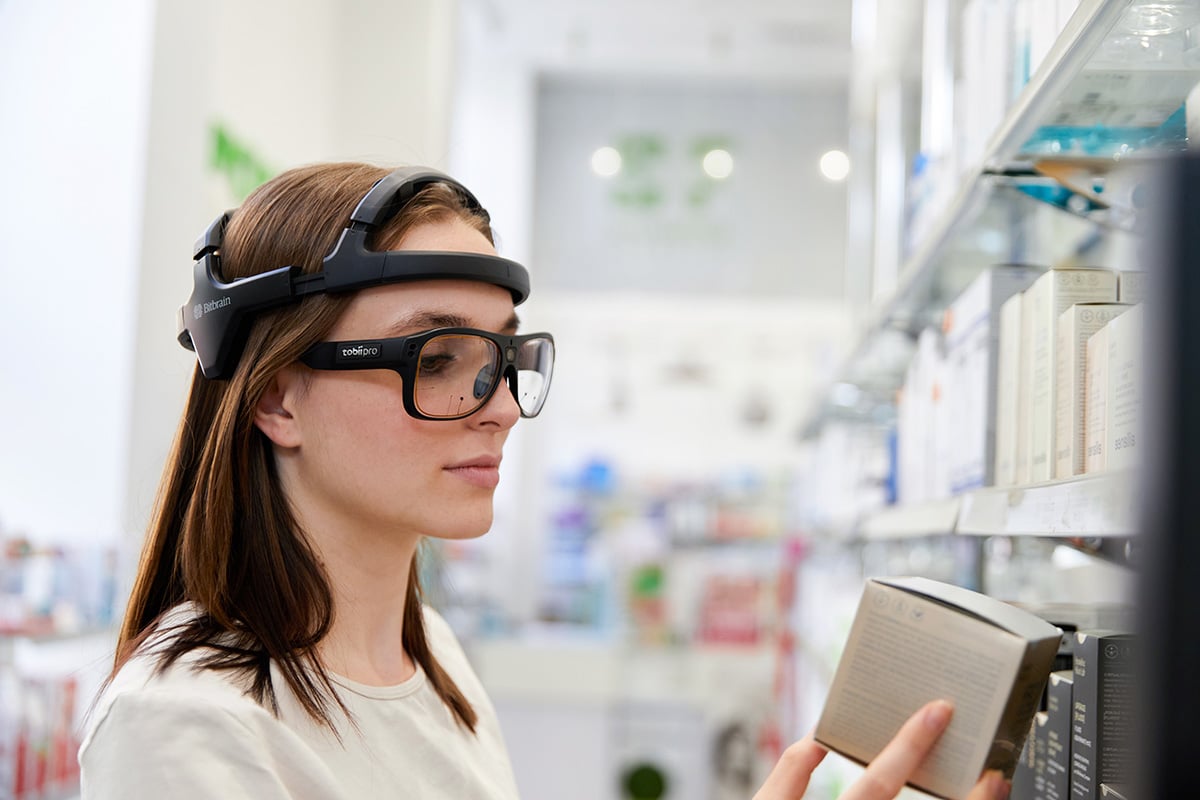 Participant wearing Tobii Glasses 3, Bitbrain Diadem, and Bitbrain in a point sale study Participant wearing Tobii Glasses 3, Bitbrain Diadem, and Bitbrain in a point sale study