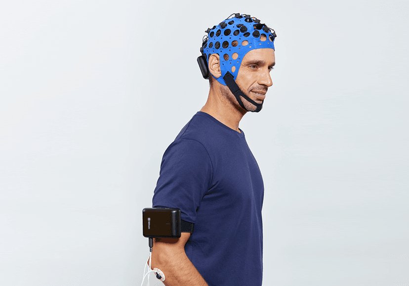 Man wearing Versatile wireless EEG cap and Versatile Bio Man wearing Versatile wireless EEG cap and Versatile Bio