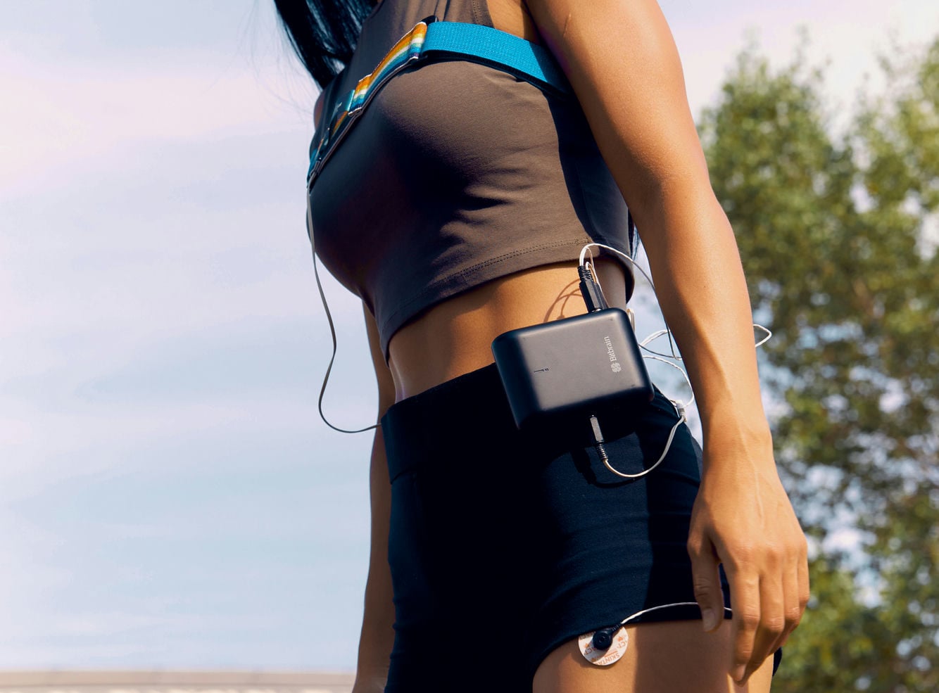 woman walking with the biosignal amplifier on the waist woman walking with the biosignal amplifier on the waist